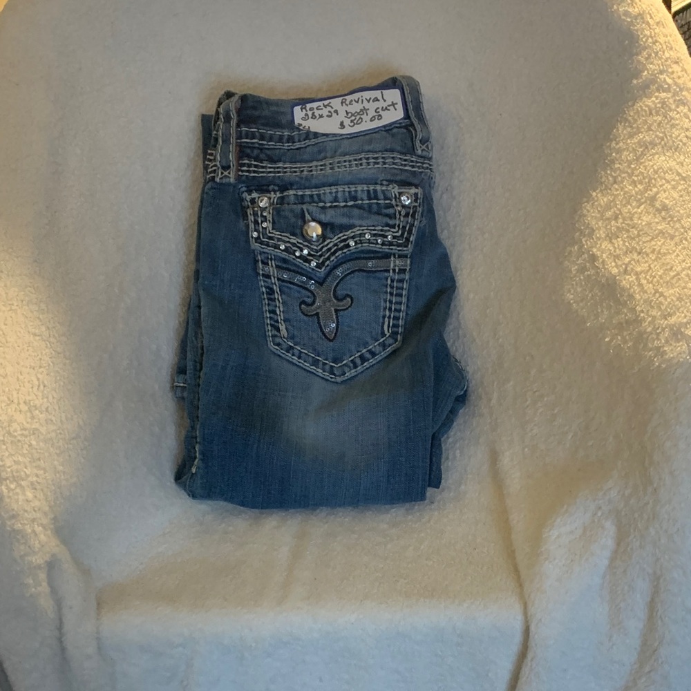 Rock Revival Blue Boot Cut Jeans with Embellished Details